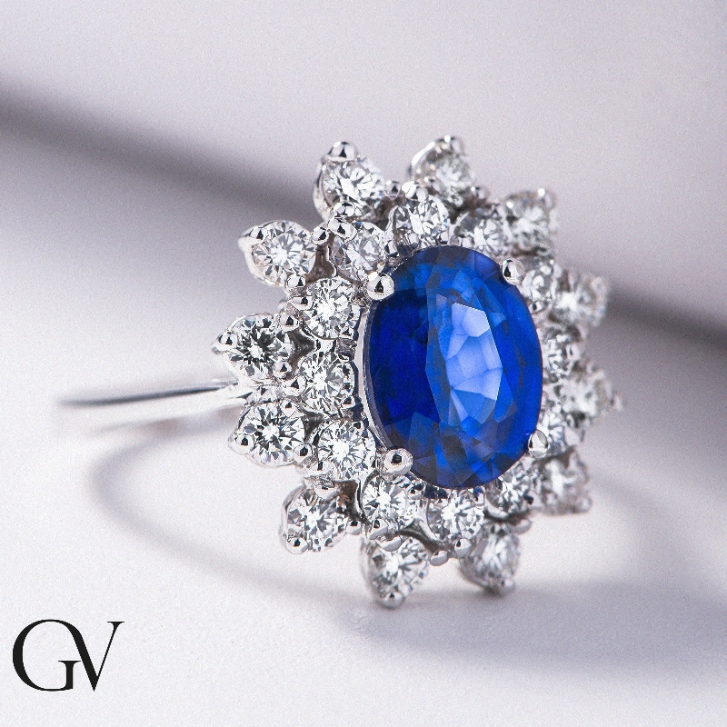 Halo Ring Weißgold 18K mit blauem Saphir und Diamanten