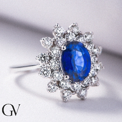 Halo Ring Weißgold 18K mit blauem Saphir und Diamanten