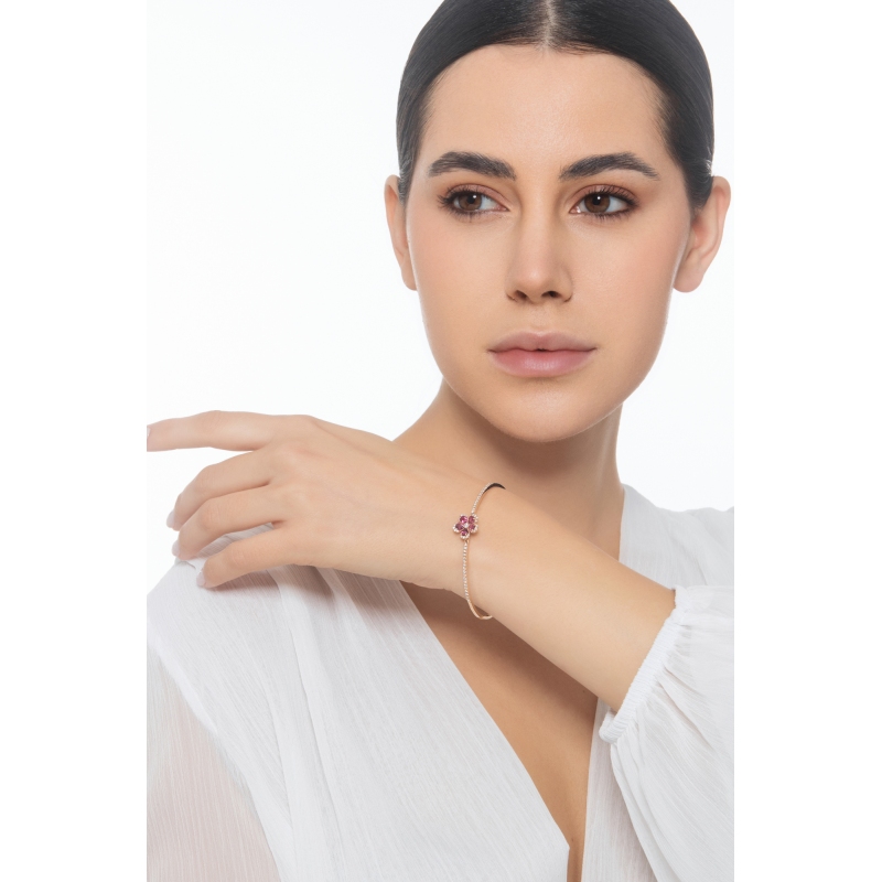 Armreif aus Roségold 18K mit Blume aus Rubinen und Brillanten Armreif aus Roségold 18K mit Blume aus Rubinen und Brillanten