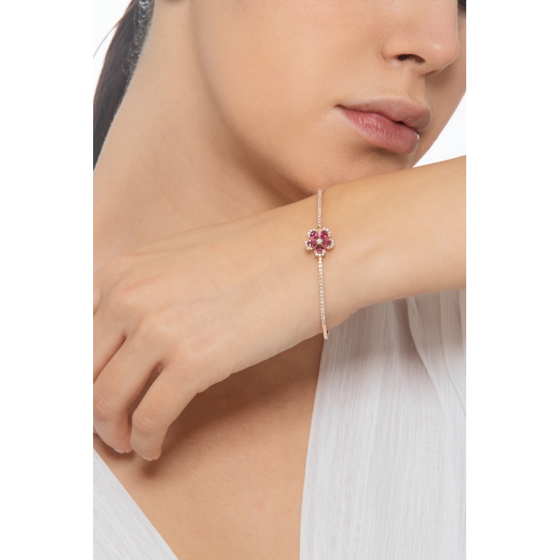 Armreif aus Roségold 18K mit Blume aus Rubinen und Brillanten Armreif aus Roségold 18K mit Blume aus Rubinen und Brillanten
