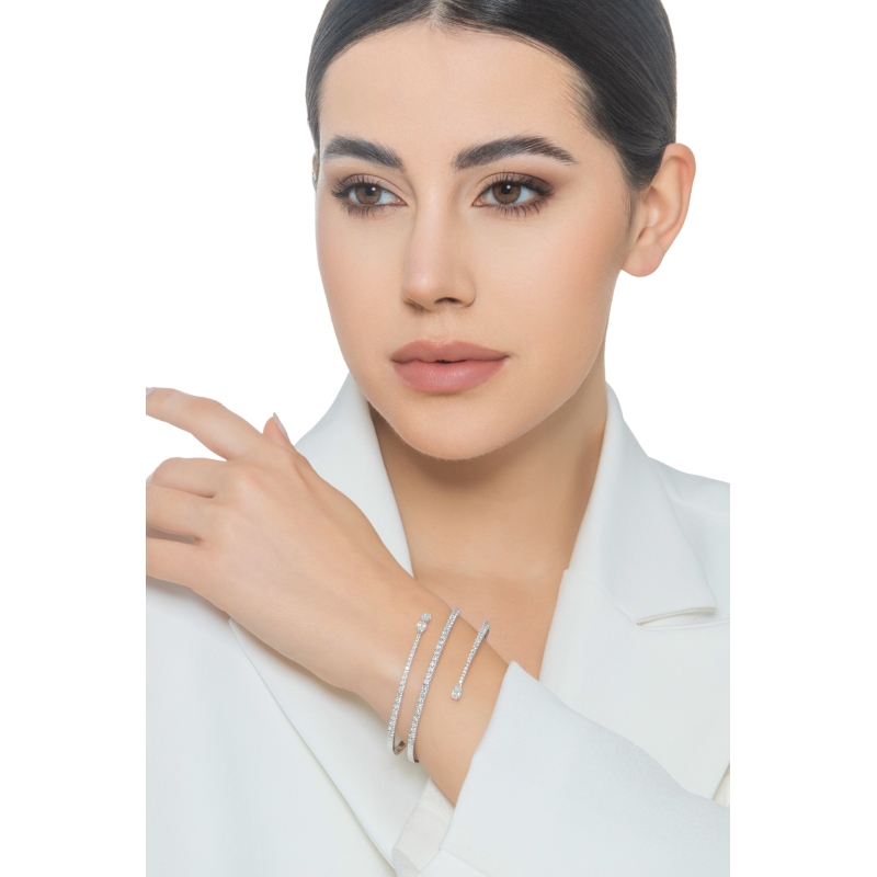 Weißgold 18K spiralförmiges Armband mit Brillanten und 3 Diamanten Tropfenschliff