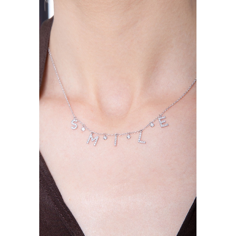 Kette aus Weißgold mit Schriftzug SMILE aus Diamanten